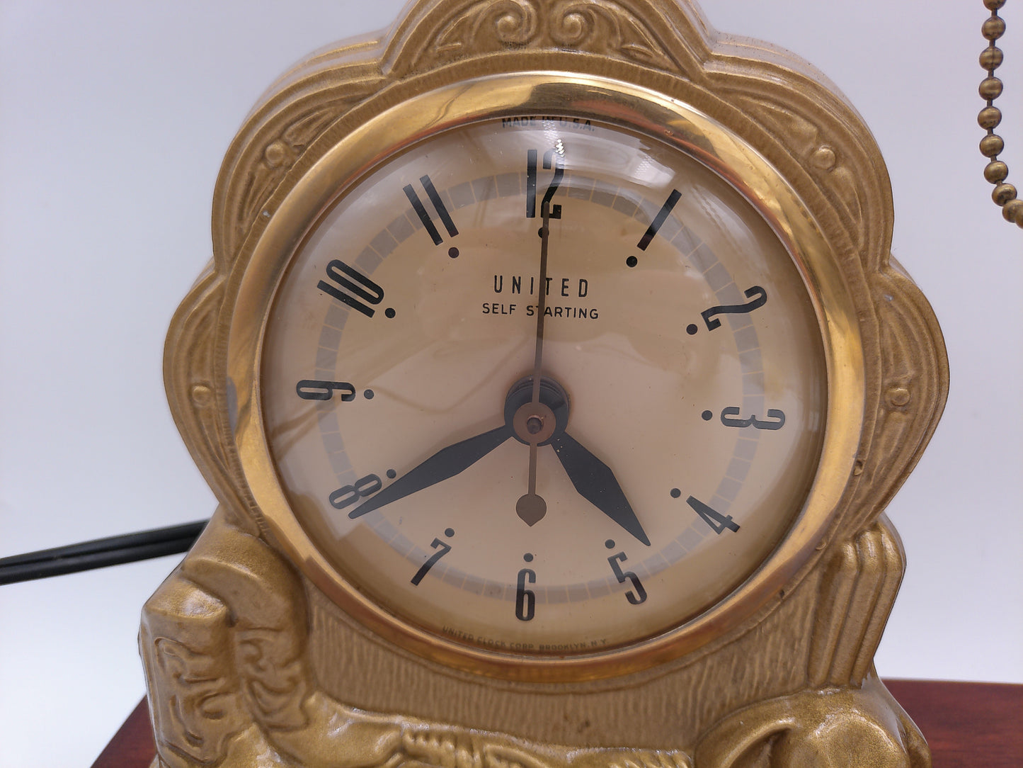 mid-century United self-starting horse clock