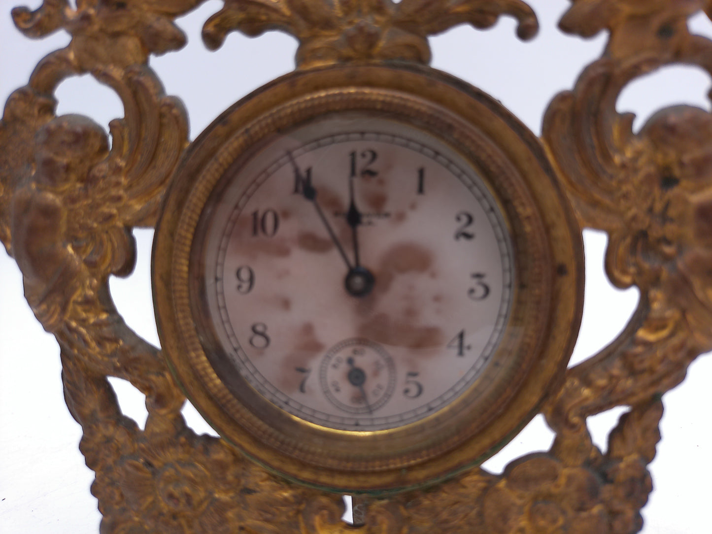 New Haven Clock with Brass Stand and Angels Antique