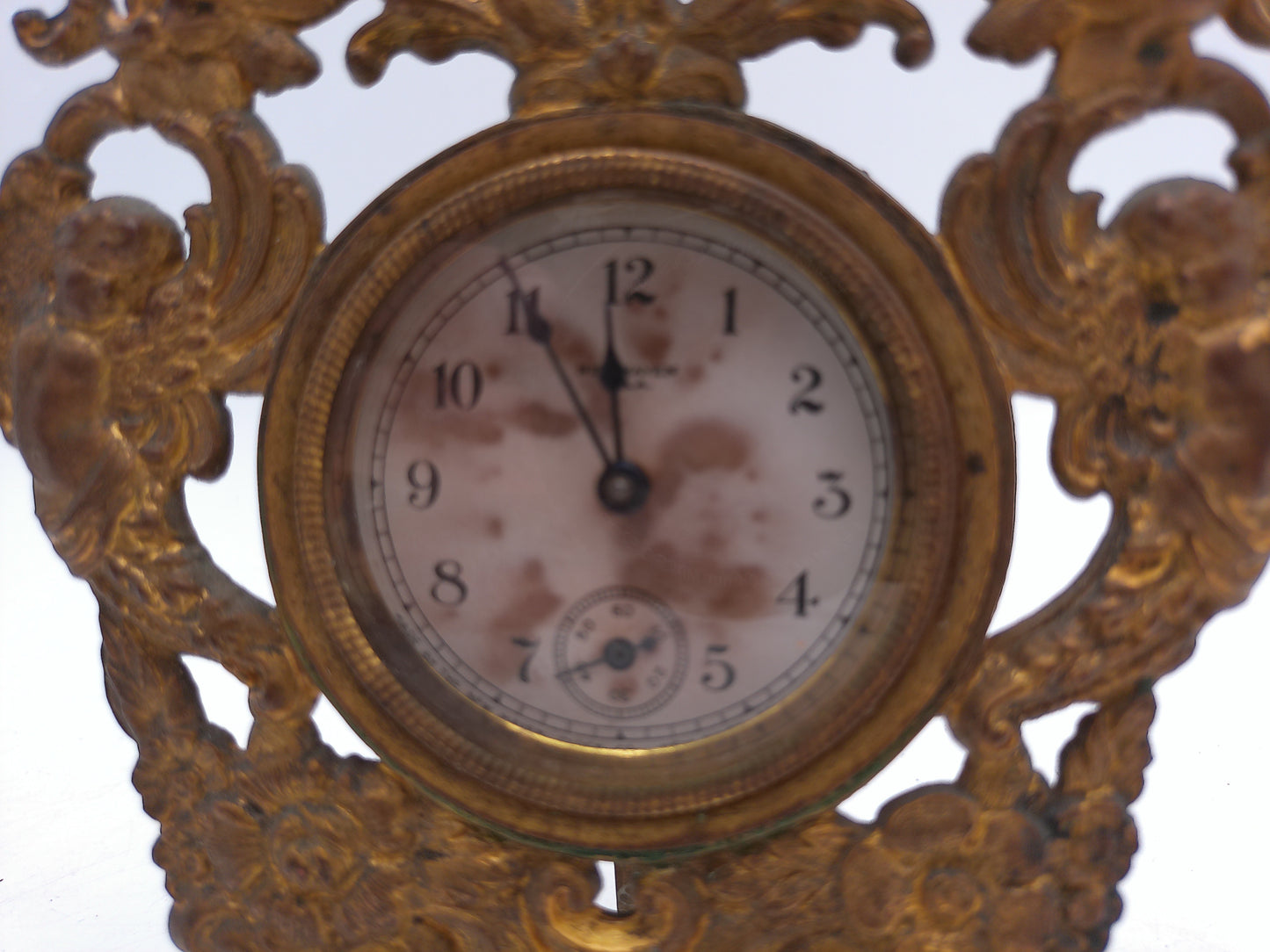 New Haven Clock with Brass Stand and Angels Antique