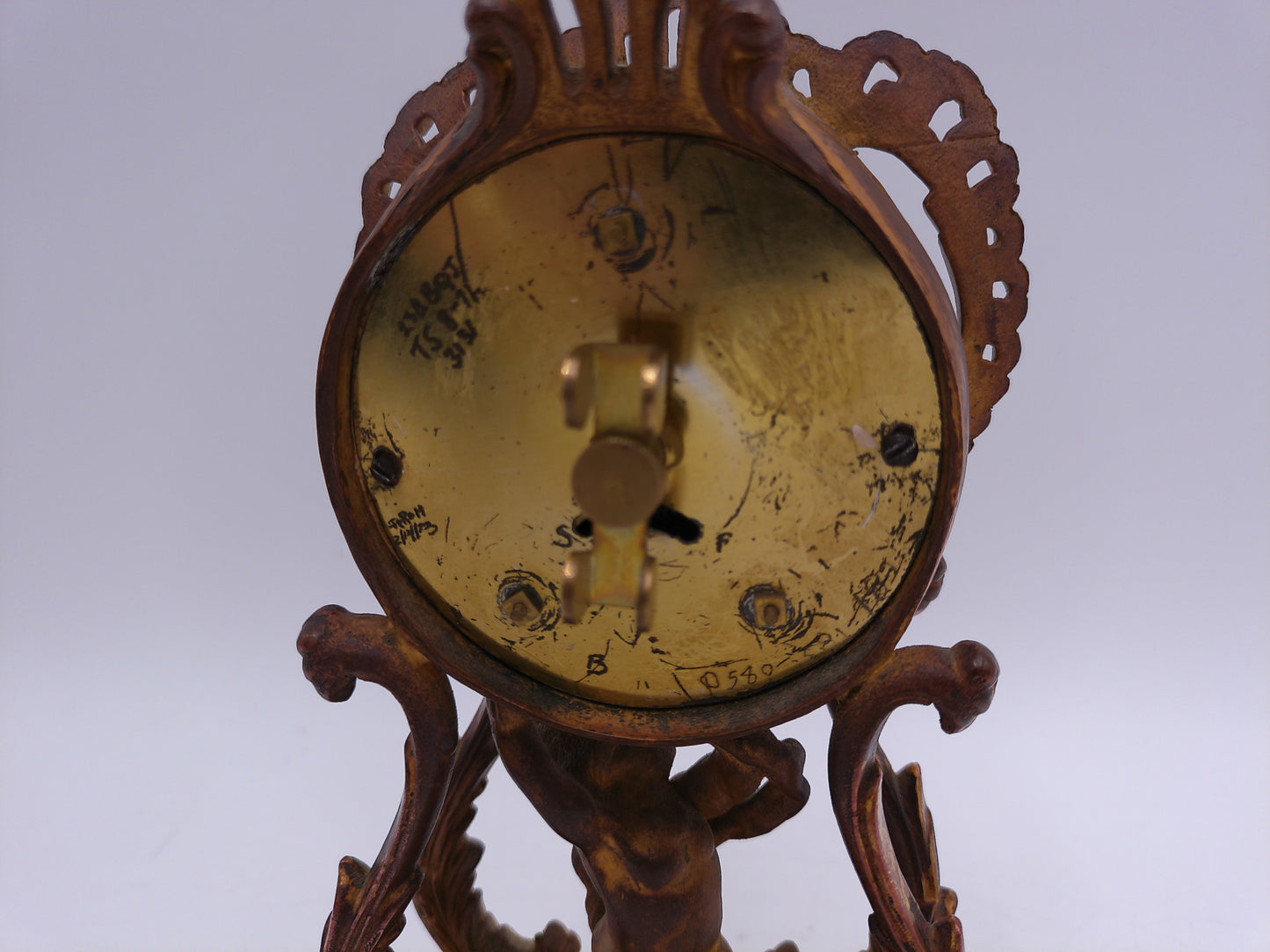 Waterbury Clock Co. Brass Table Clock  featuring figural cherub and scroll motif Vintage