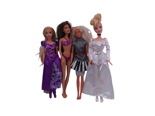 4 Vintage Barbies one is a Disney Barbie