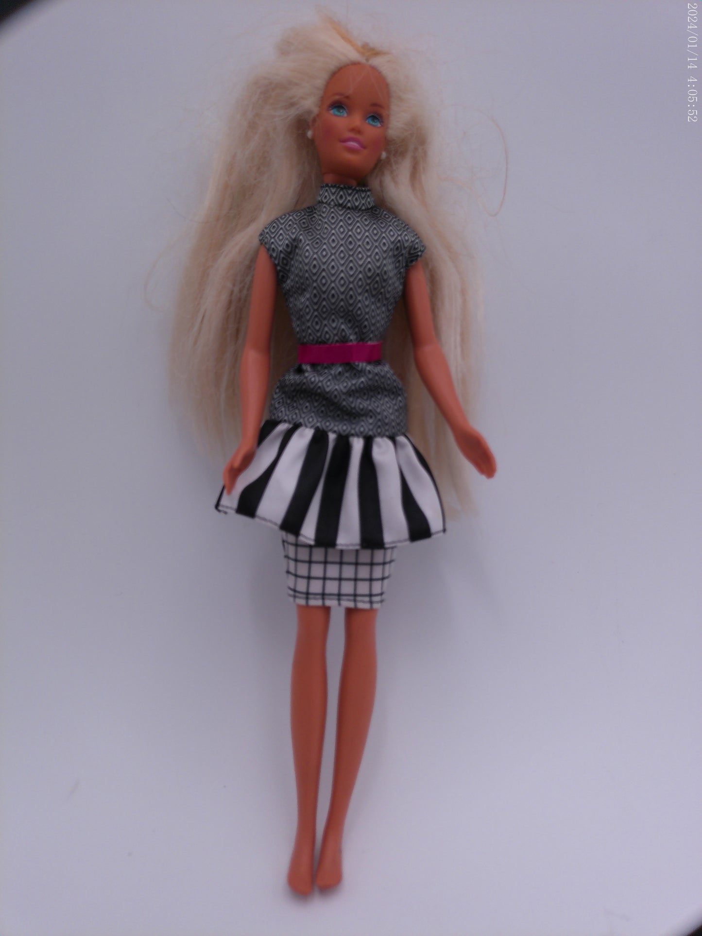 4 Vintage Barbies one is a Disney Barbie