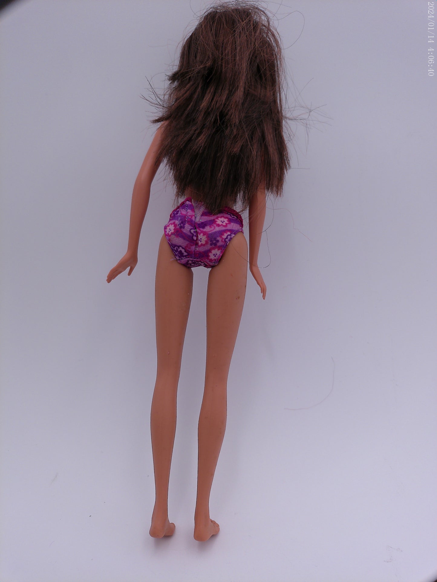 4 Vintage Barbies one is a Disney Barbie