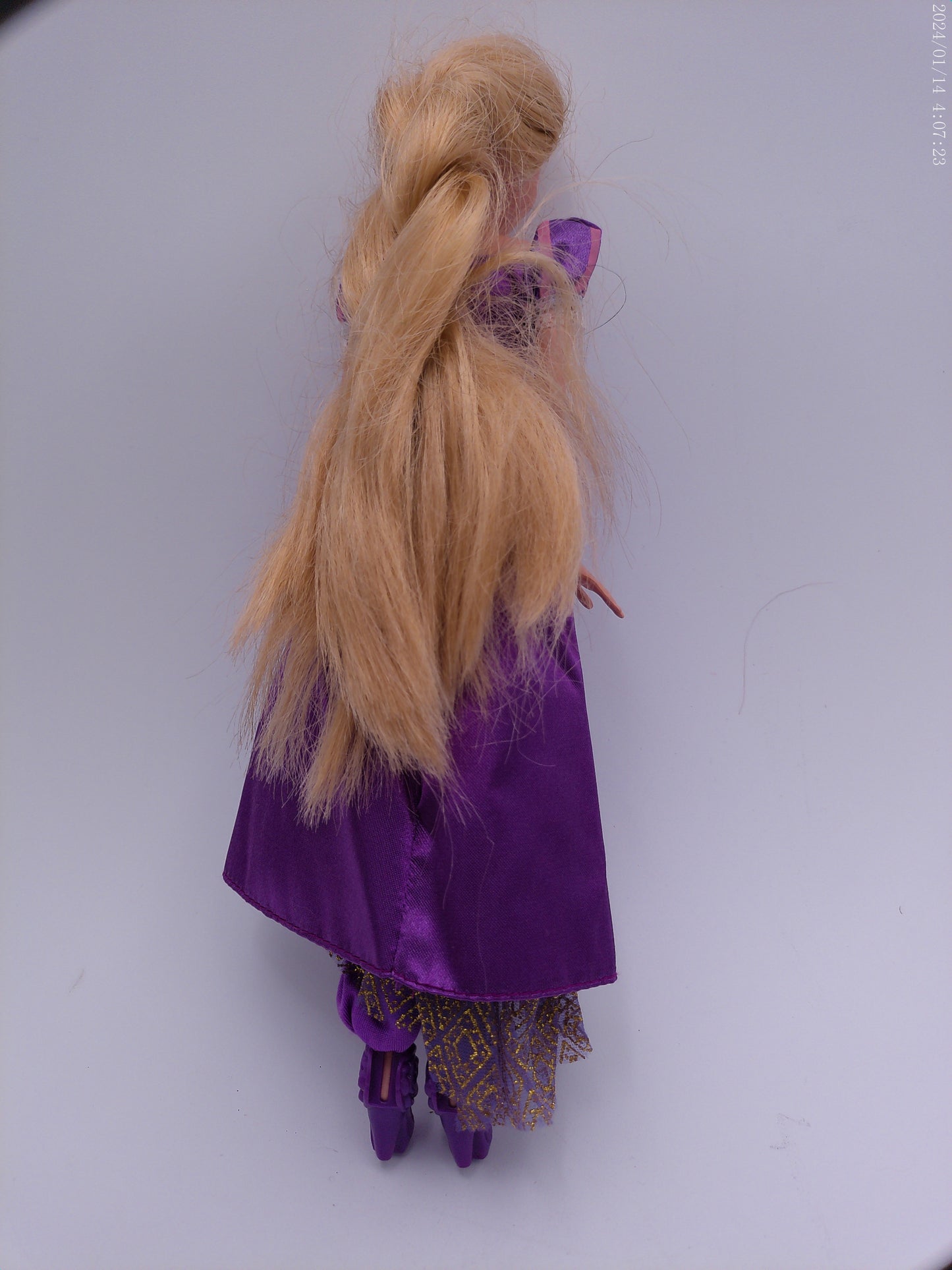 4 Vintage Barbies one is a Disney Barbie