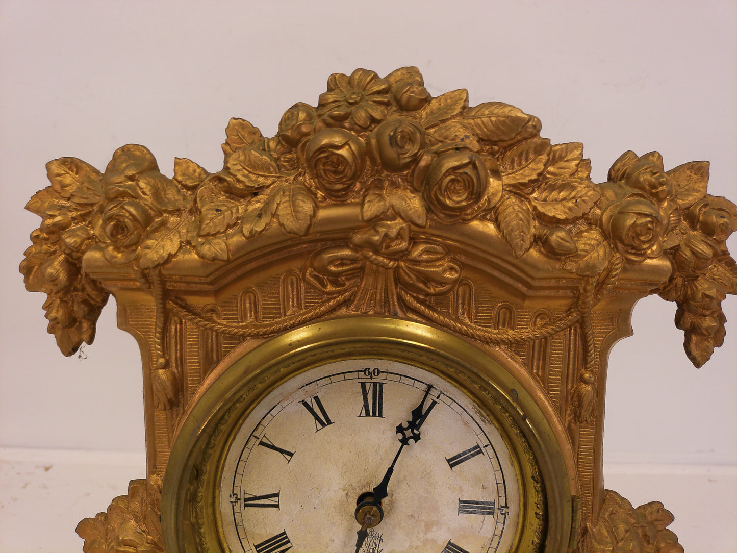 Ornate antique Gold painted Metal Clock With Wood Backing