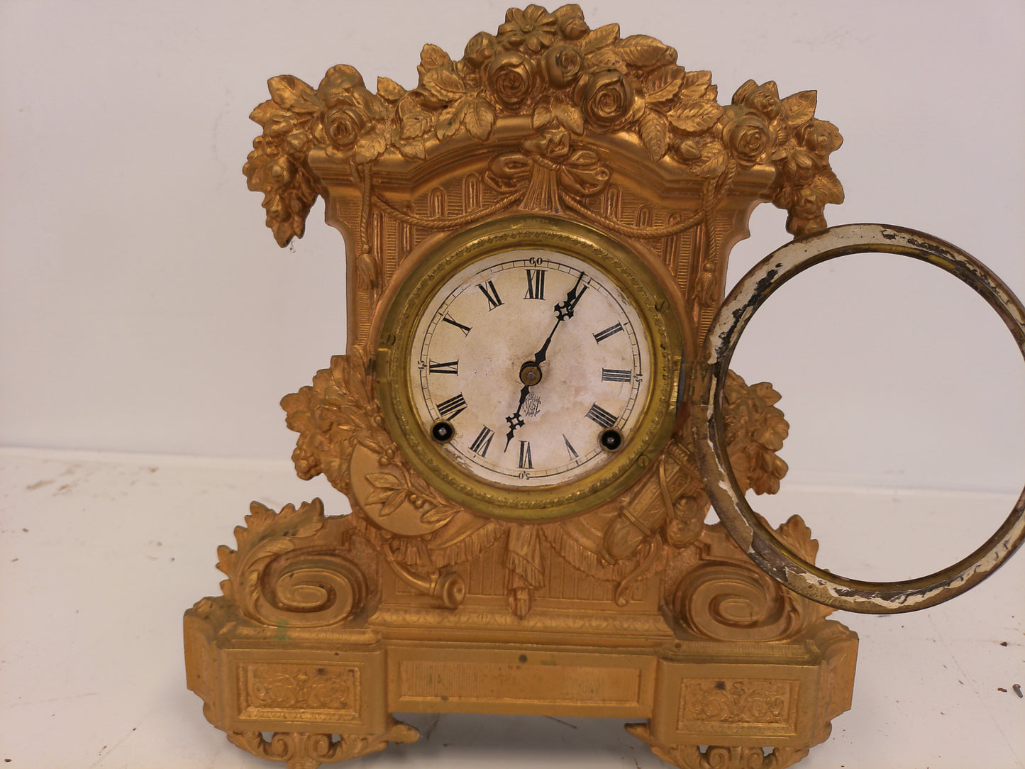 Ornate antique Gold painted Metal Clock With Wood Backing