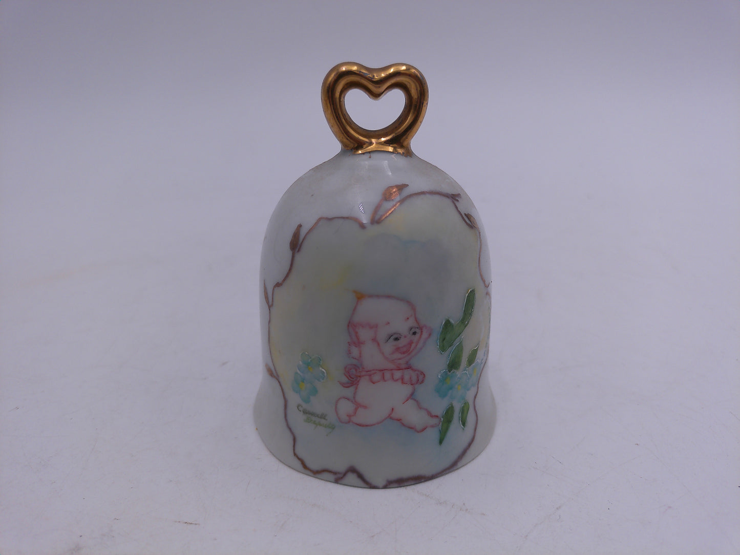 Kewpie  and other Figurines  lot of 8  and a Bell