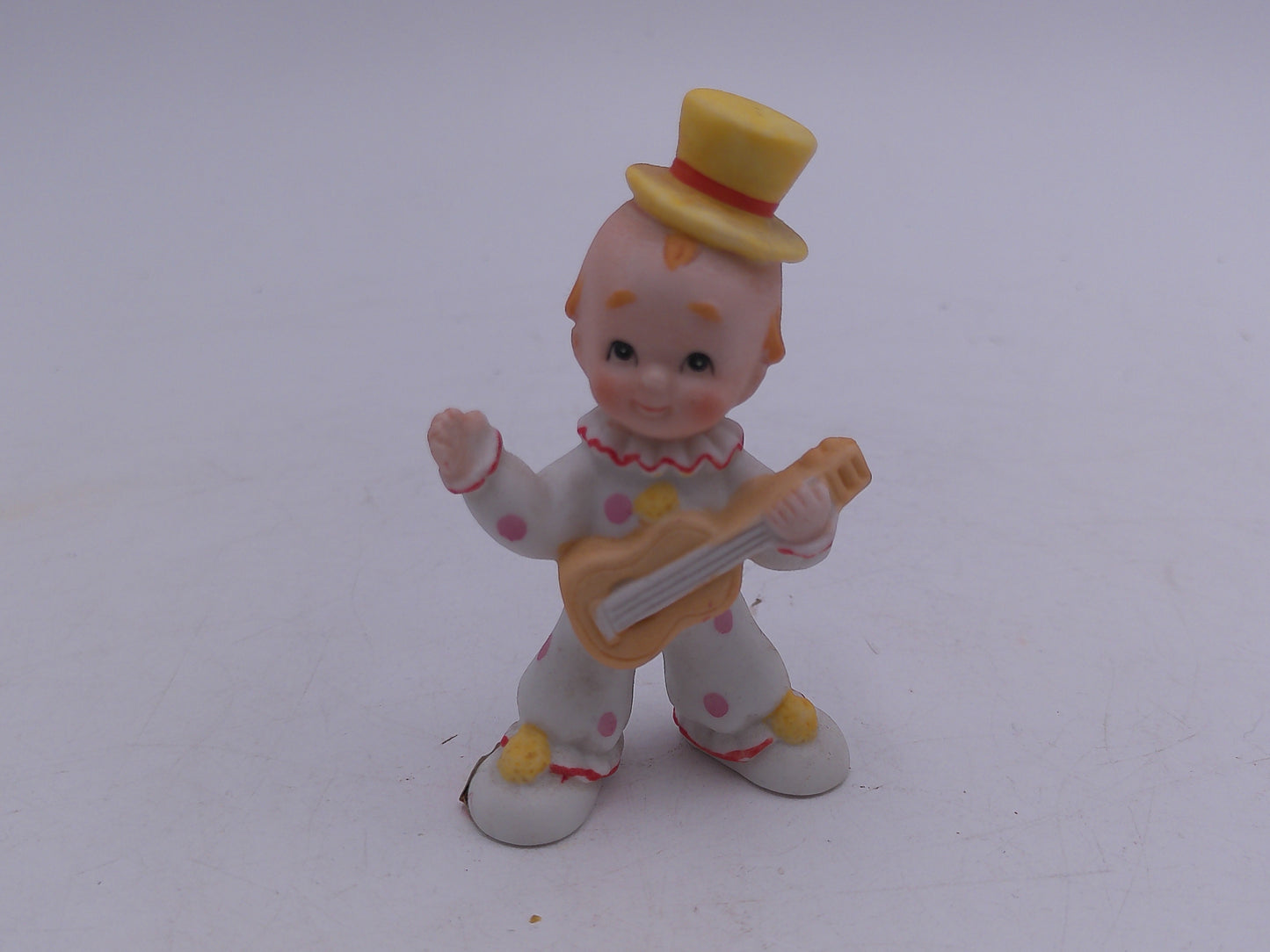 Kewpie  and other Figurines  lot of 8  and a Bell