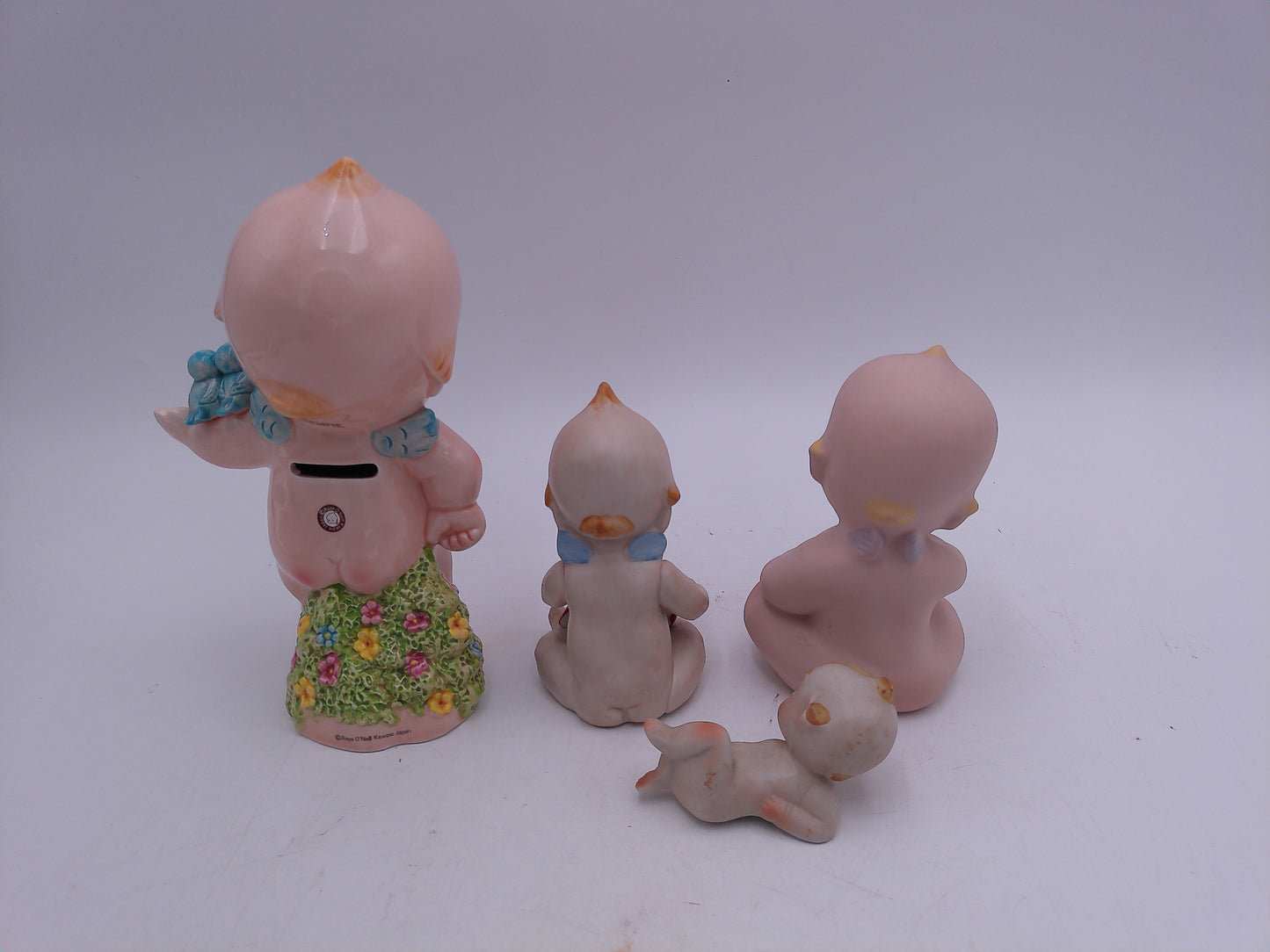 Kewpie Lot of 4 one is a bank Holding a Heart Sitting Figurines Bisque Porcelain