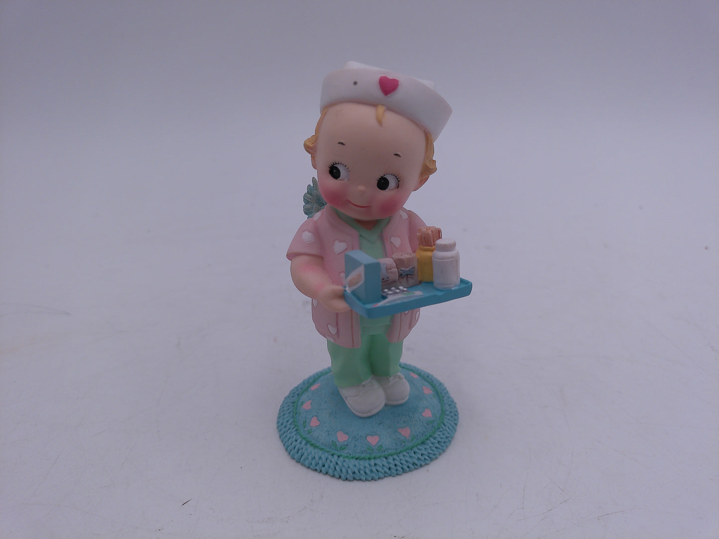 Kewpie Lot of 6 Kewpie in hand Nurse With Rabbit with Basket