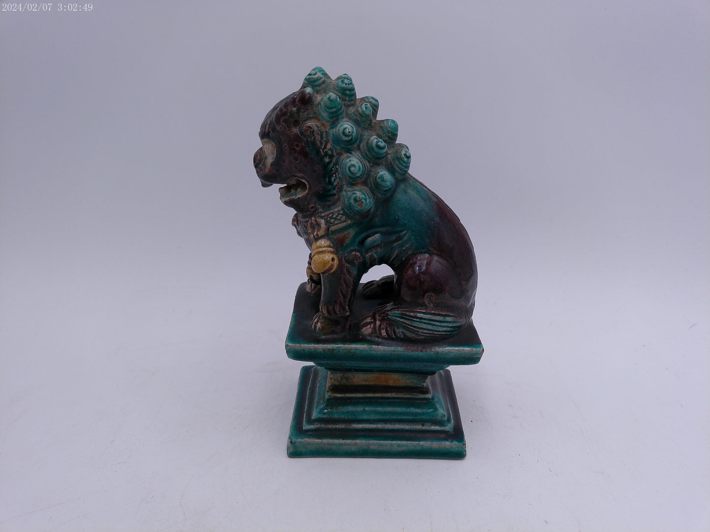 A Chinese figure of a dog-of-fo, Qing Dynasty, late 19th/early 20th century seated,