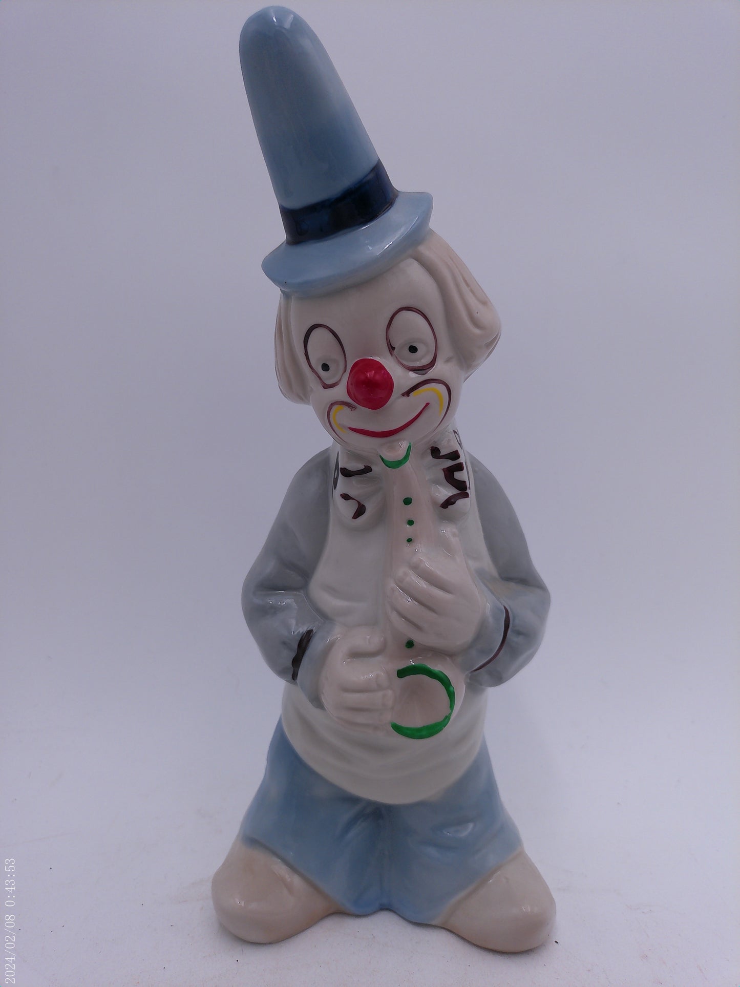 Collection of 4 Porcelain Clowns with Instruments