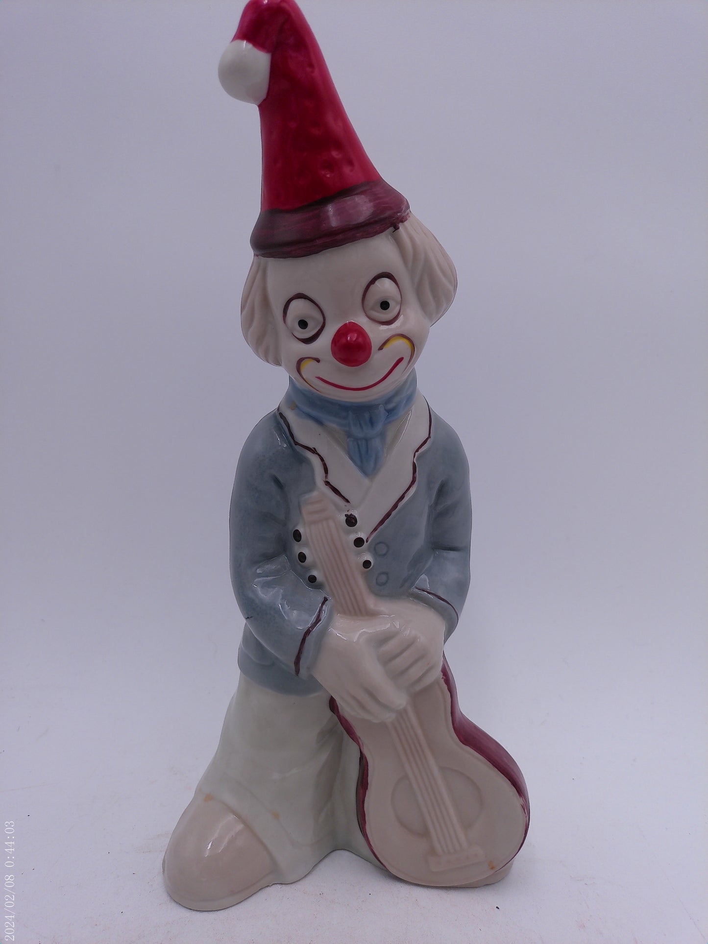 Collection of 4 Porcelain Clowns with Instruments