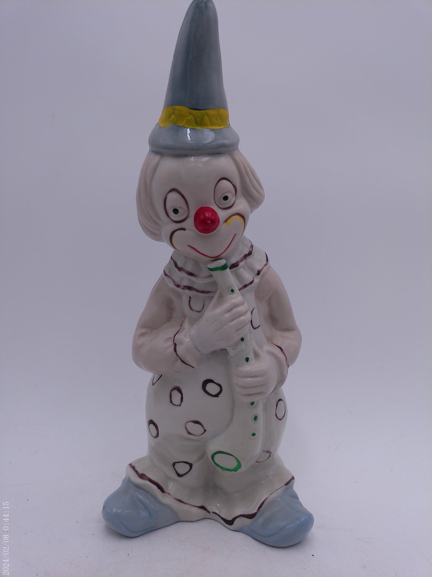 Collection of 4 Porcelain Clowns with Instruments