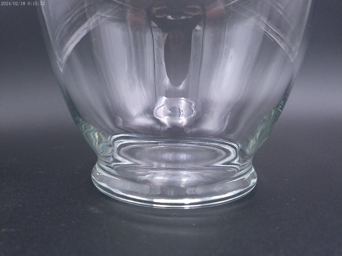 Clear glass vase is designed in a round bubble style,