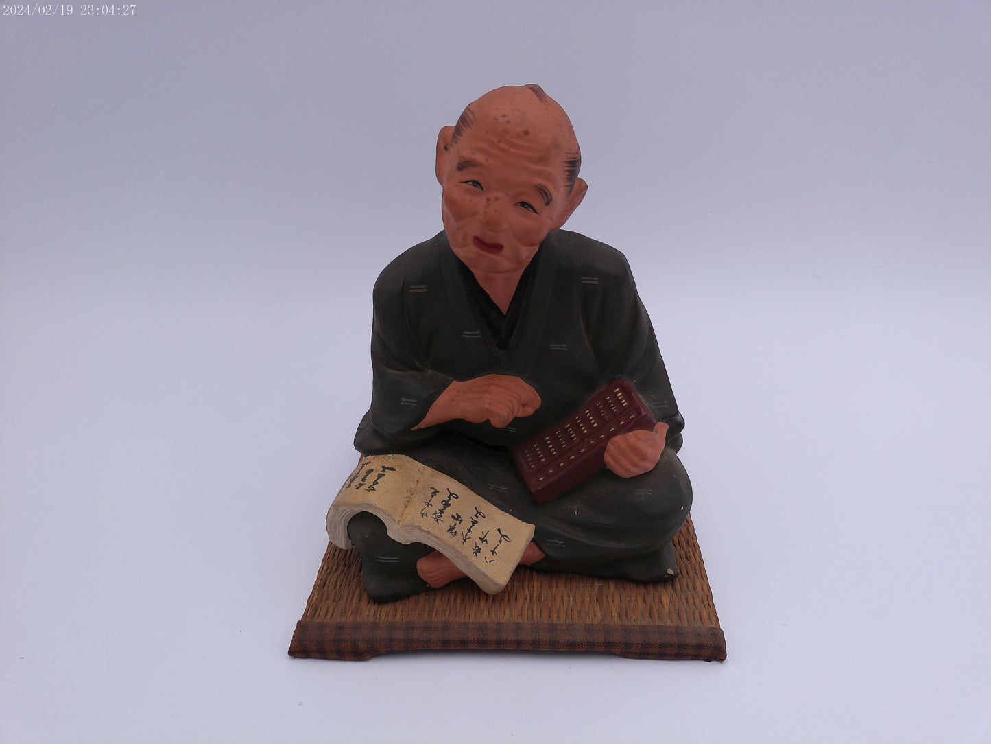 Japanese men figurine with book  vintage