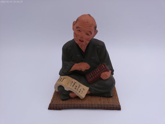 Japanese men figurine with book  vintage