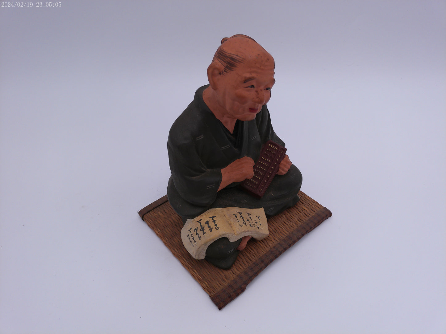Japanese men figurine with book  vintage