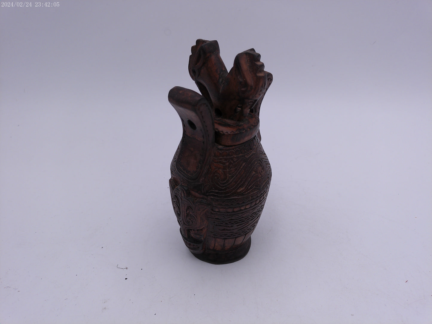 Very Old container has a detailed carved design all around, it has two handles and top lid.