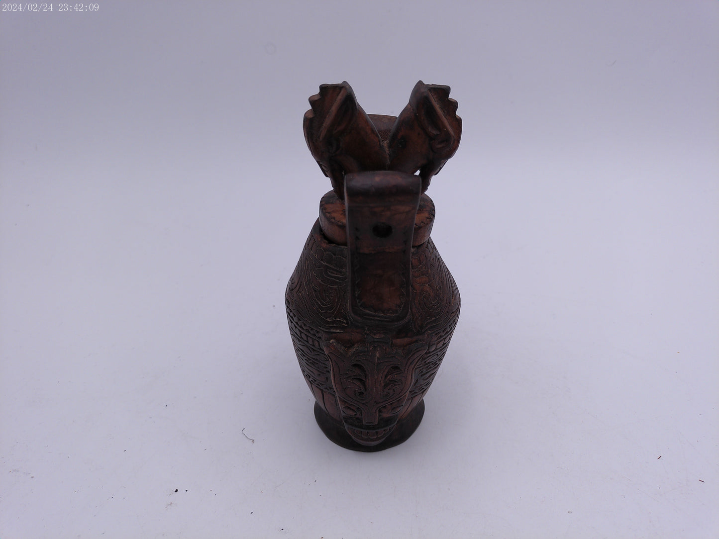 Very Old container has a detailed carved design all around, it has two handles and top lid.