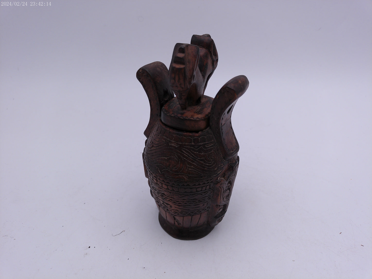 Very Old container has a detailed carved design all around, it has two handles and top lid.