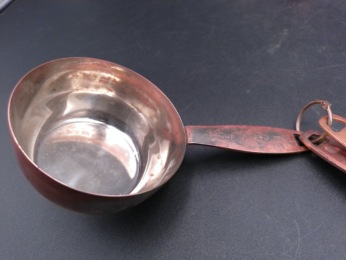 Hammered Copper 8 Piece Measuring Cup Set with Hand Engraved Measurements