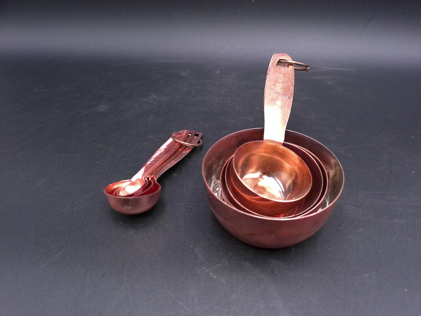 Hammered Copper 8 Piece Measuring Cup Set with Hand Engraved Measurements