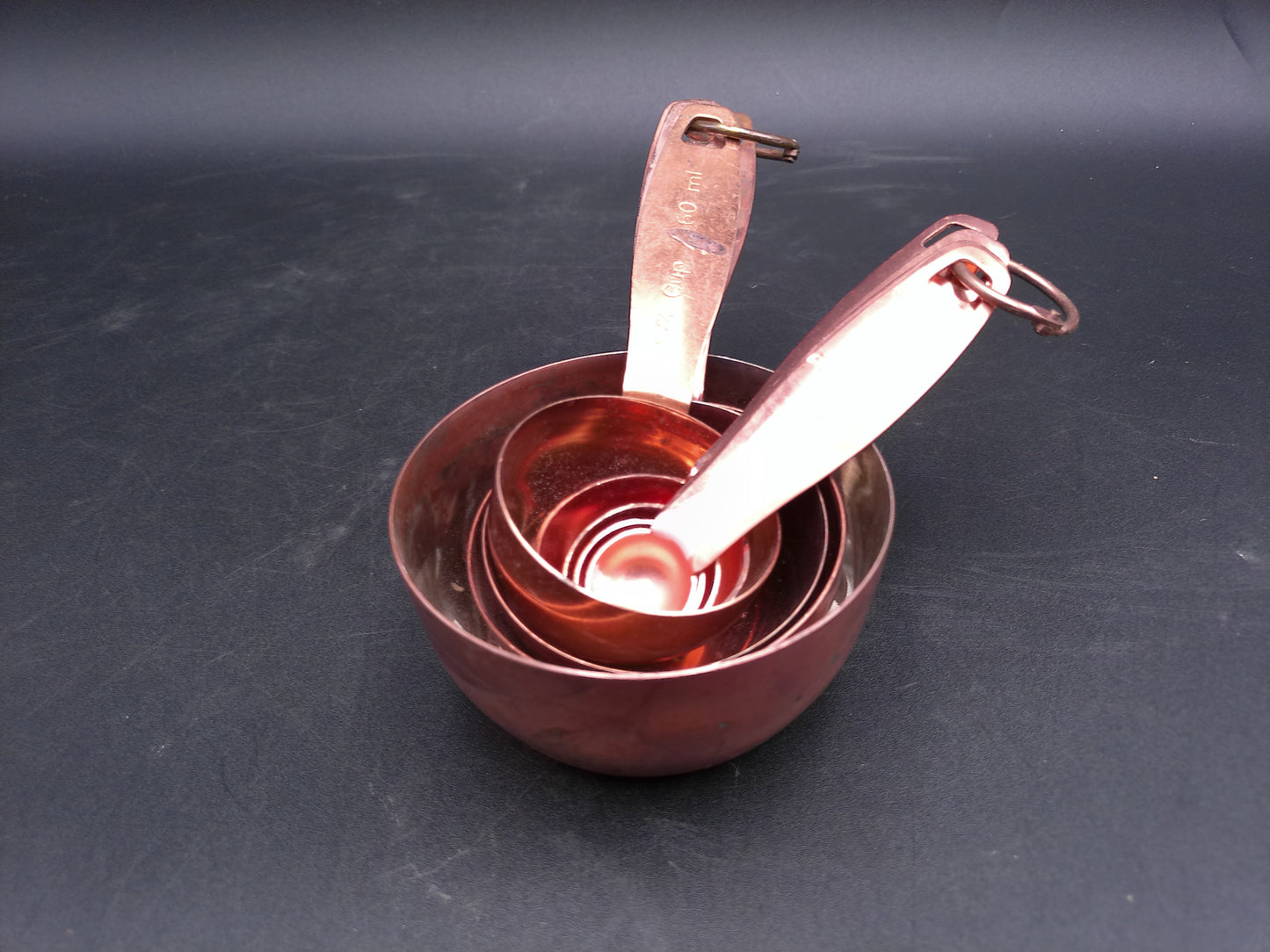 Hammered Copper 8 Piece Measuring Cup Set with Hand Engraved Measurements