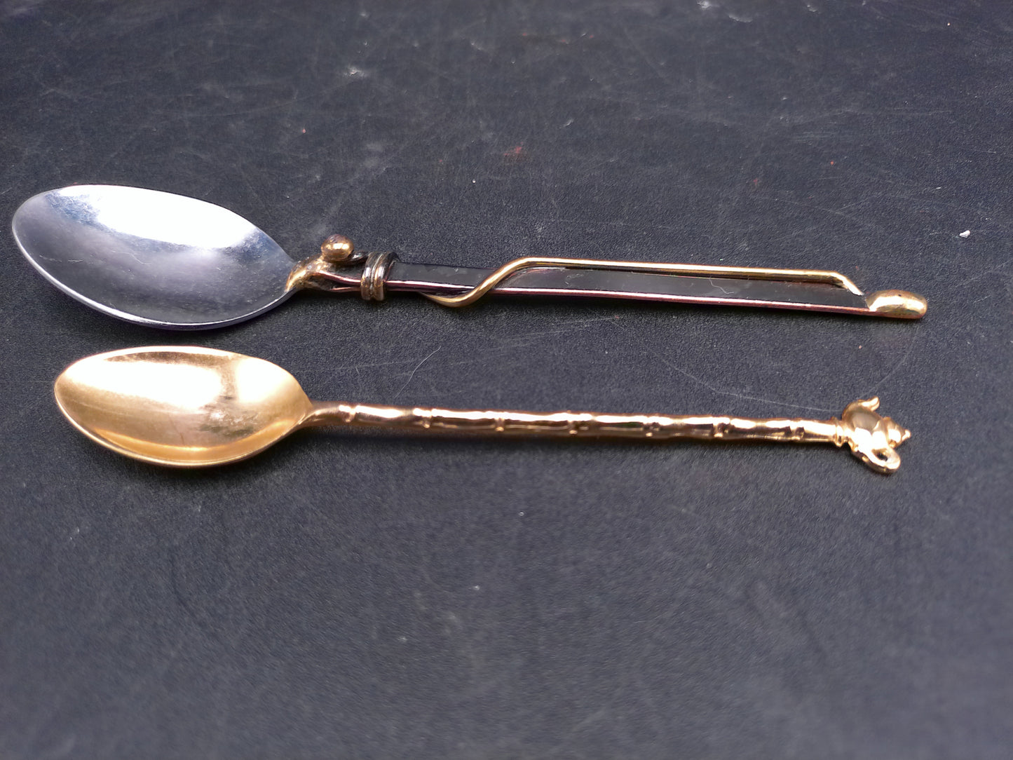 Set of 2 Spoons Gold Colored with Tea Pot on one and other Wrapped in Gold Wire