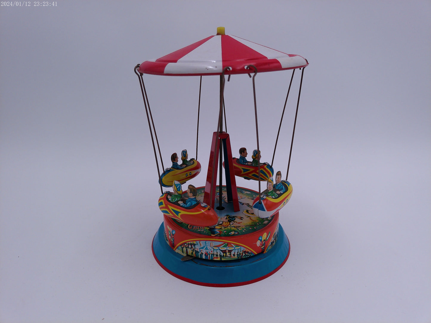 Mechanical Merry Go Round  Roundabout with Gondolas Tin Toy Spins