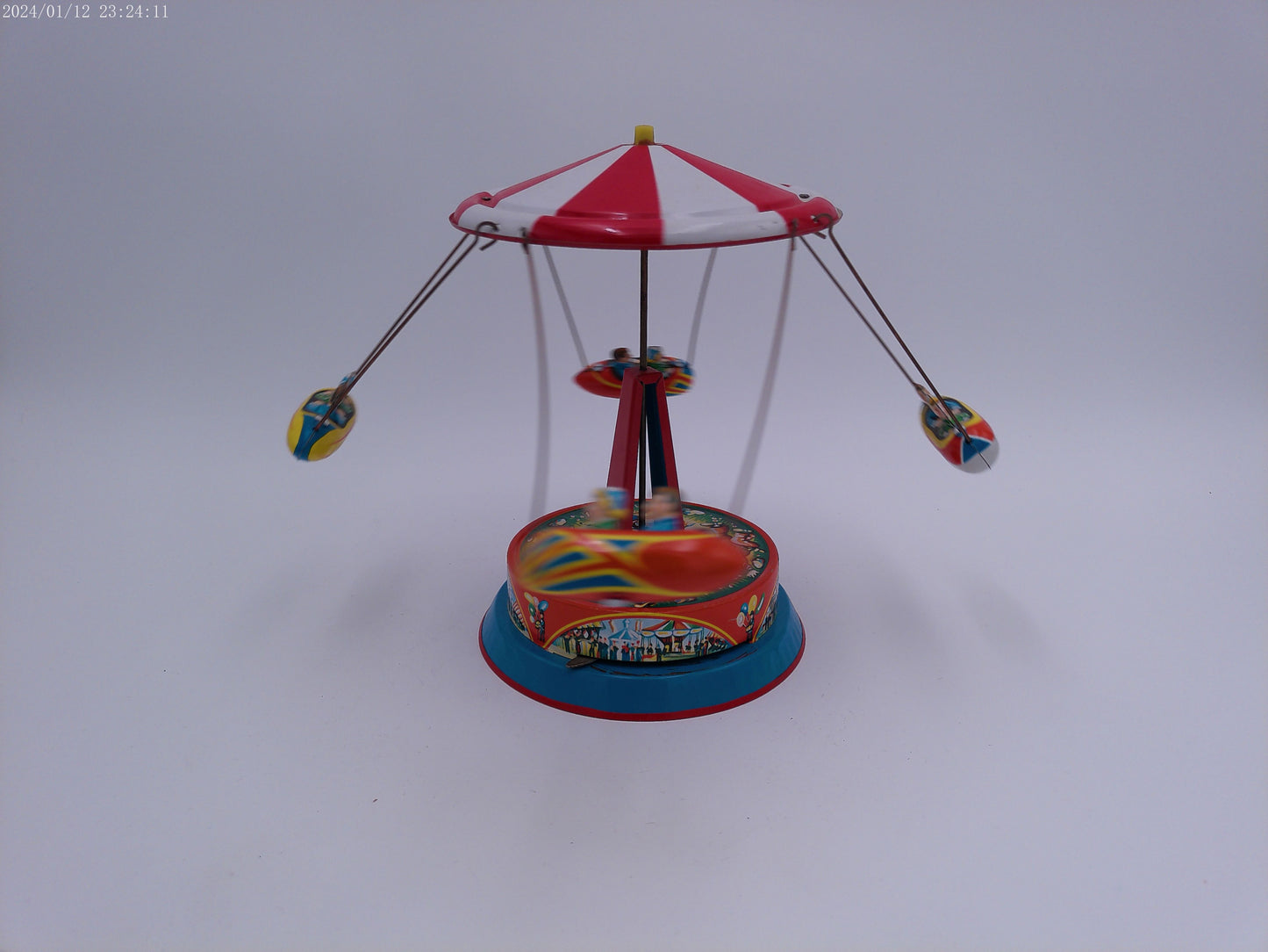 Mechanical Merry Go Round  Roundabout with Gondolas Tin Toy Spins