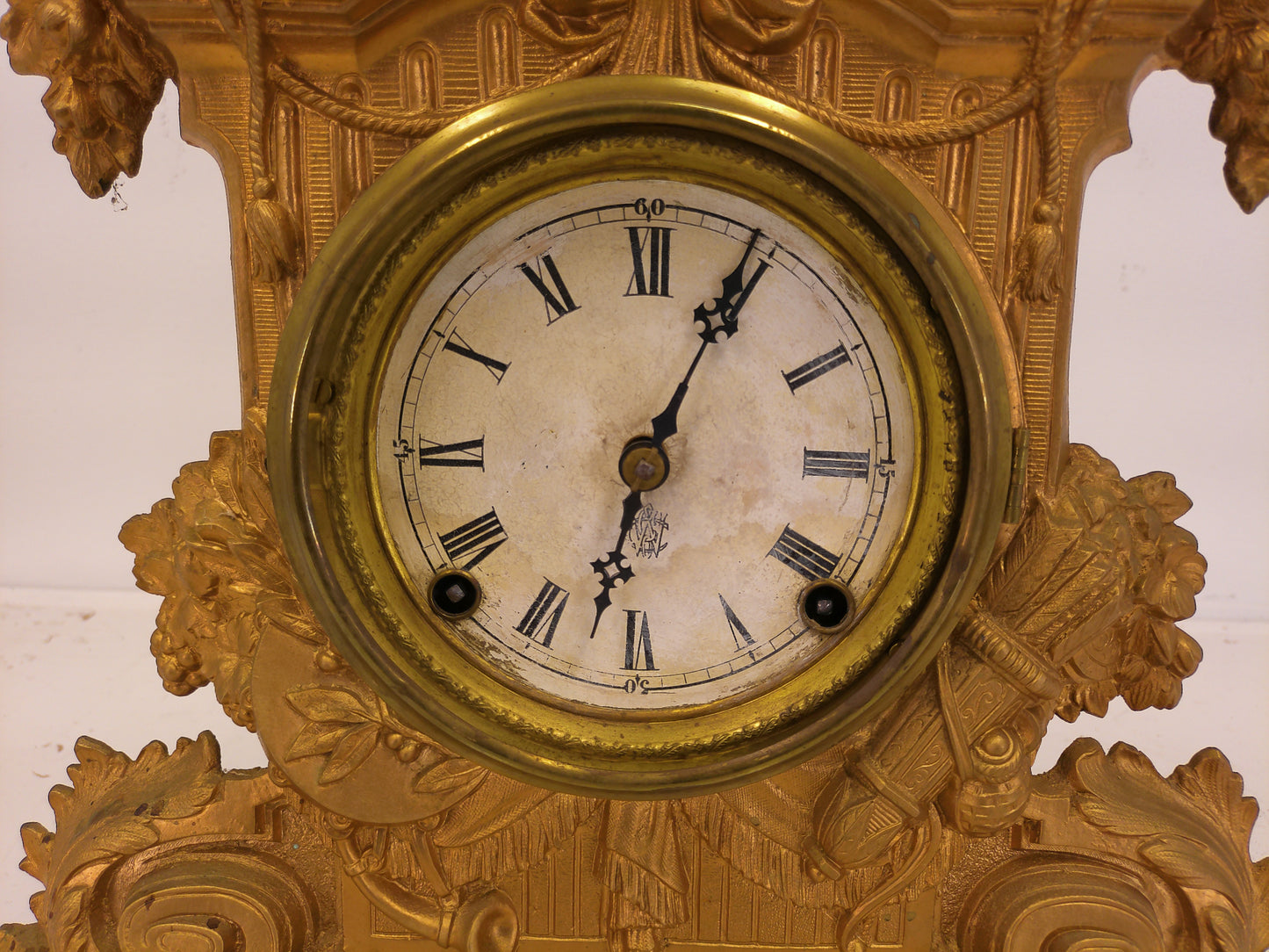 Ornate antique Gold painted Metal Clock With Wood Backing