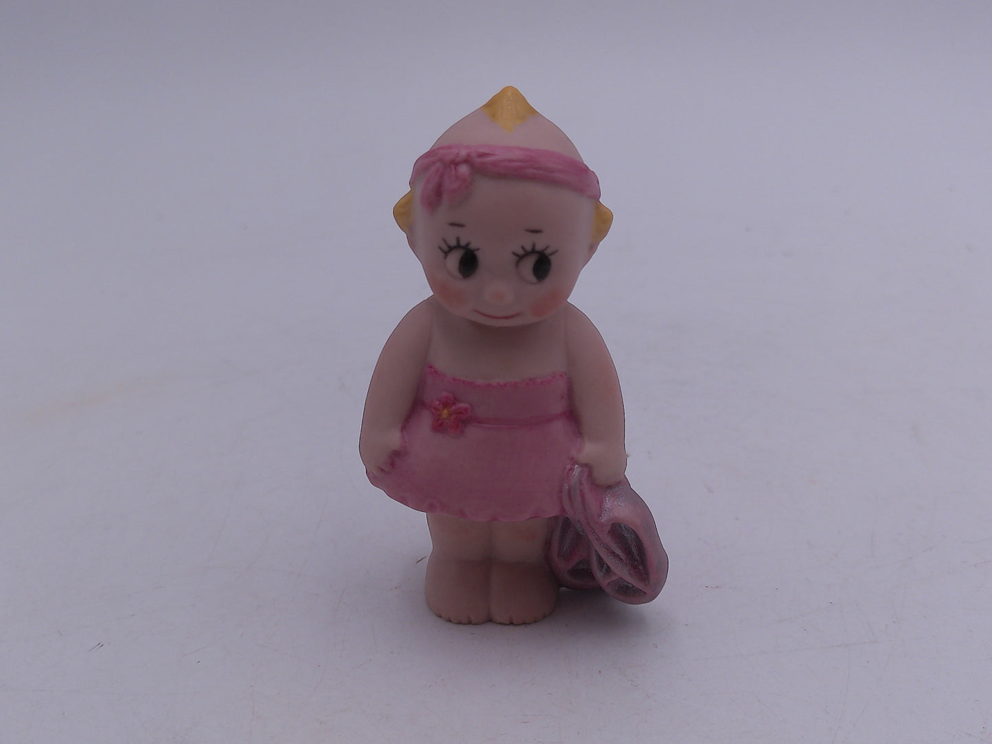 Kewpie  and other Figurines  lot of 8  and a Bell