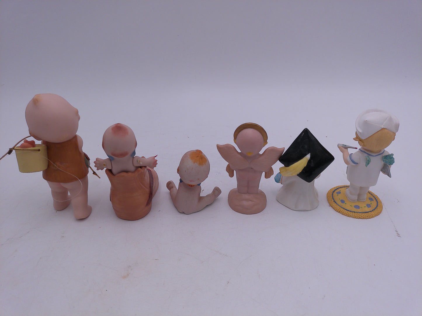 Kewpie lot of 6 Nurse Graduation Angel Noel Kewpie in Shoe and Fishing Vintage