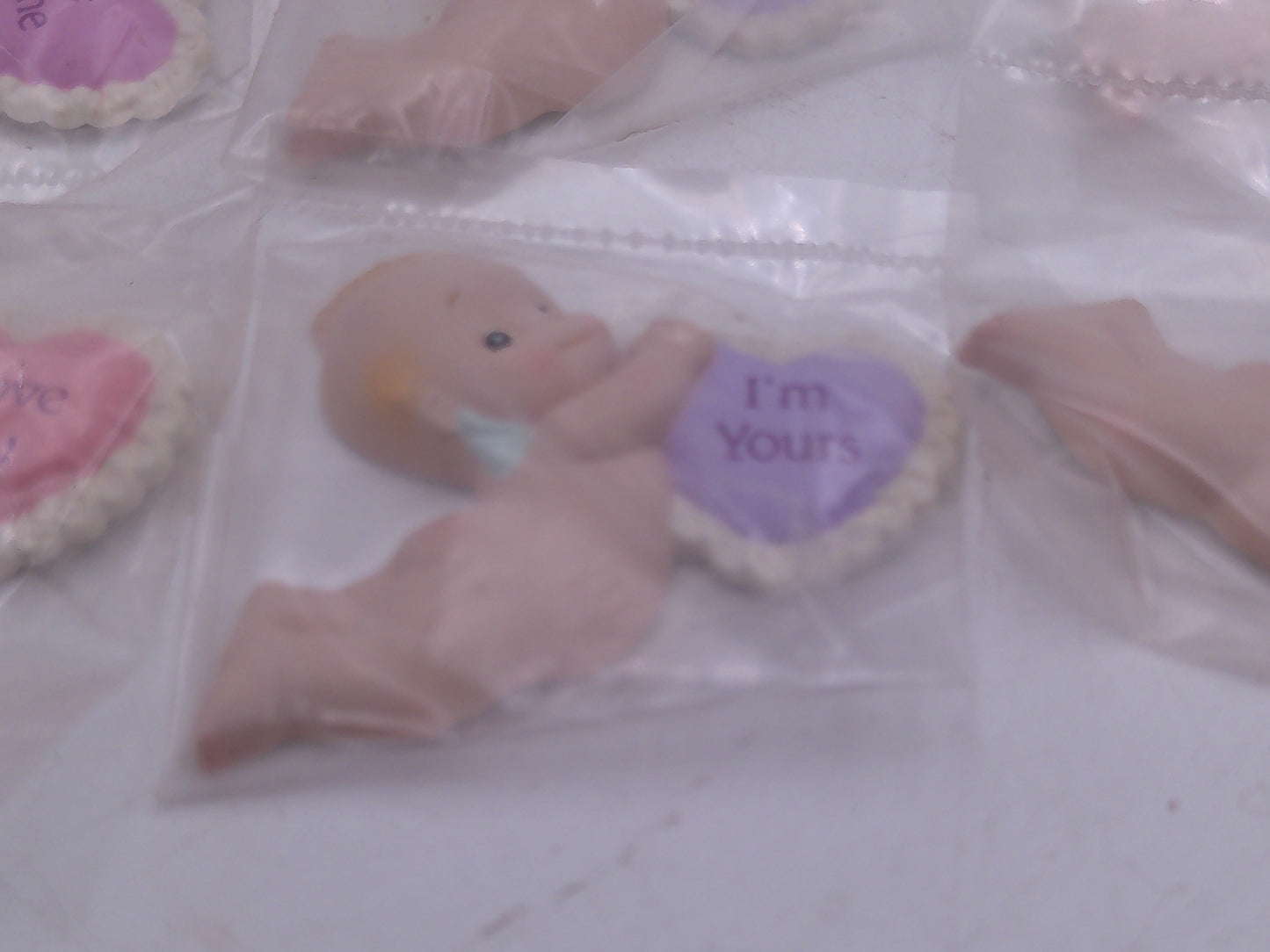 Kewpie Valentine figures with heart message in Jar