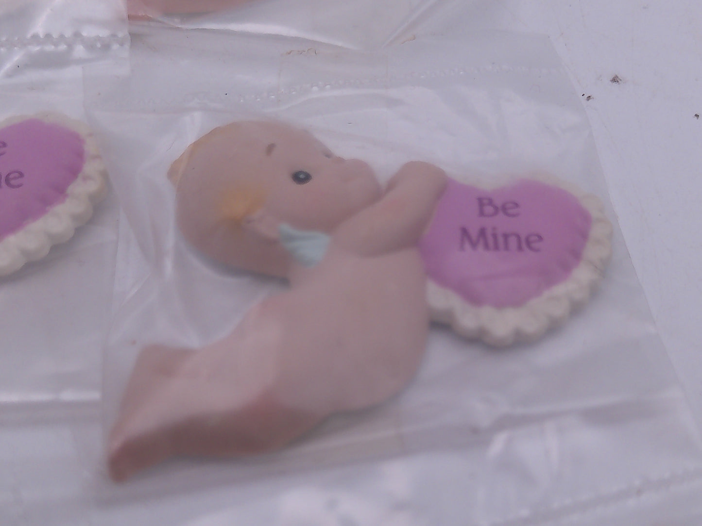 Kewpie Valentine figures with heart message in Jar