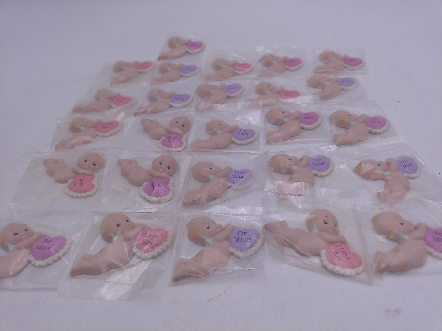 Kewpie Valentine figures with heart message in Jar