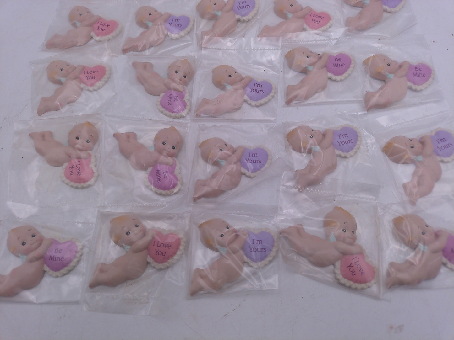Kewpie Valentine figures with heart message in Jar