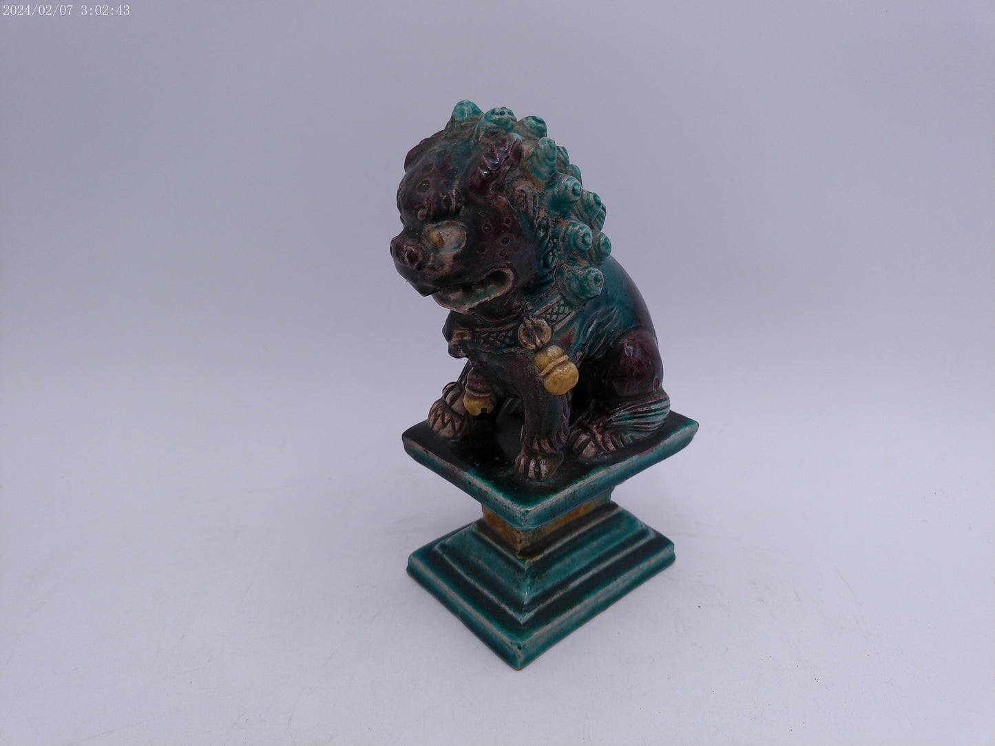 A Chinese figure of a dog-of-fo, Qing Dynasty, late 19th/early 20th century seated,