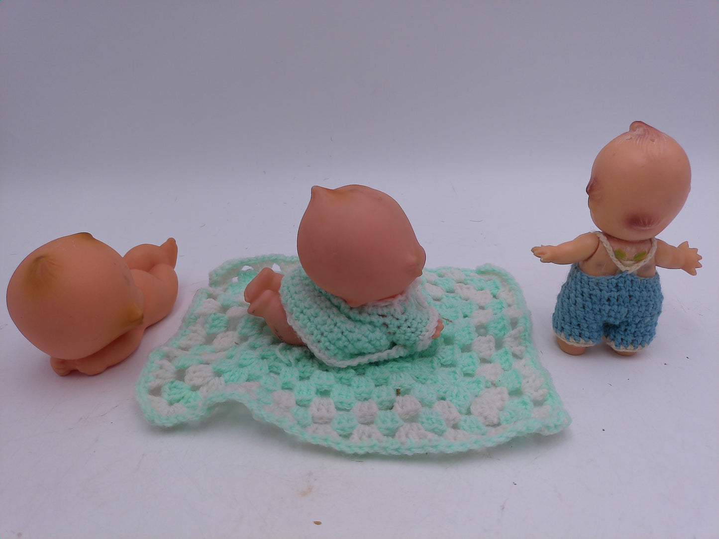 Kewpie Dolls Lot pf 3 one imight be powder dispenser and one on Blanket Vintage