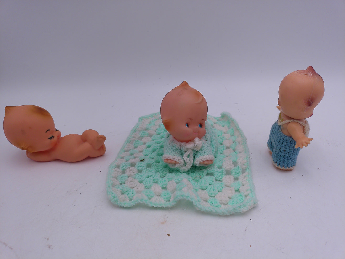 Kewpie Dolls Lot pf 3 one imight be powder dispenser and one on Blanket Vintage