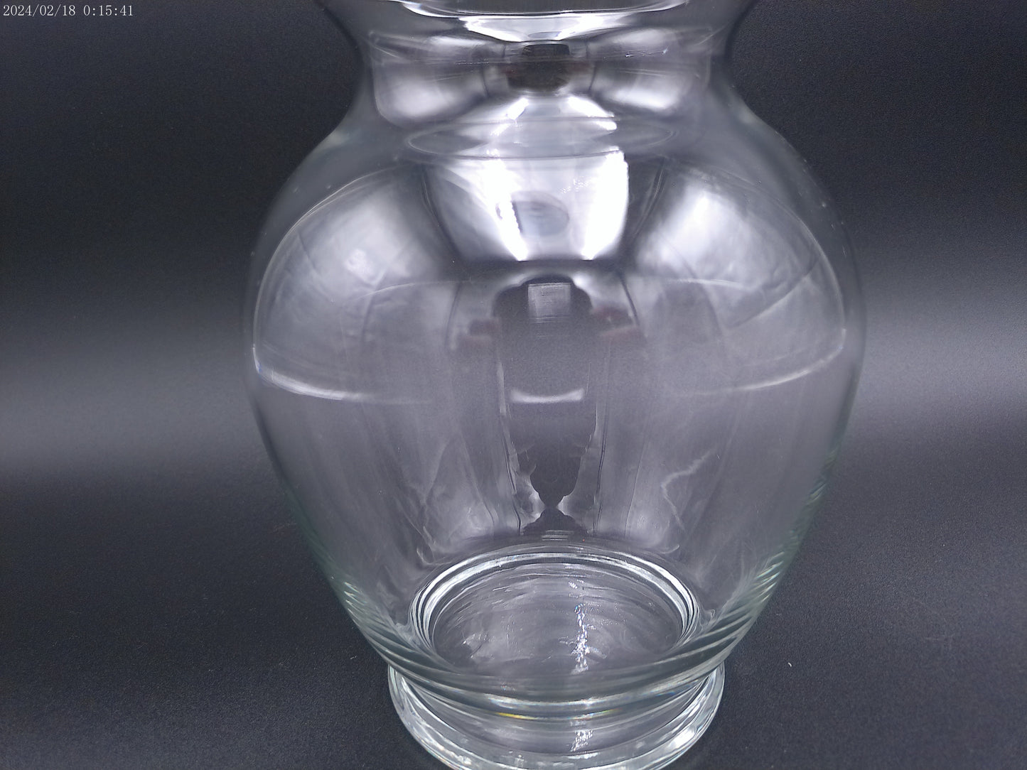 Clear glass vase is designed in a round bubble style,