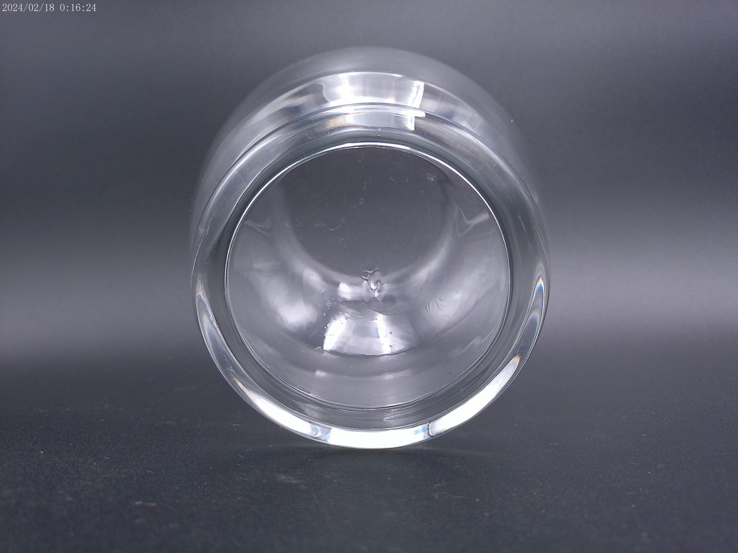 Clear glass vase is designed in a round bubble style,