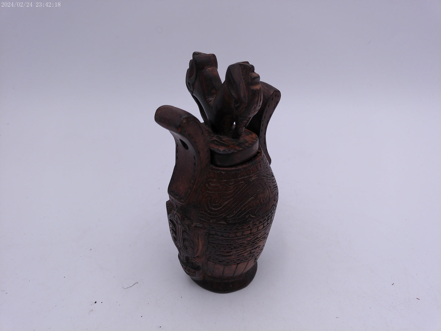 Very Old container has a detailed carved design all around, it has two handles and top lid.
